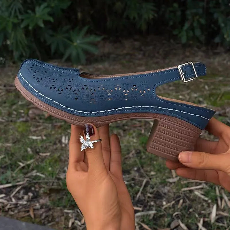 Women's closed toe wedge sandal in PU leather with a round toe and rubber wedge sole.