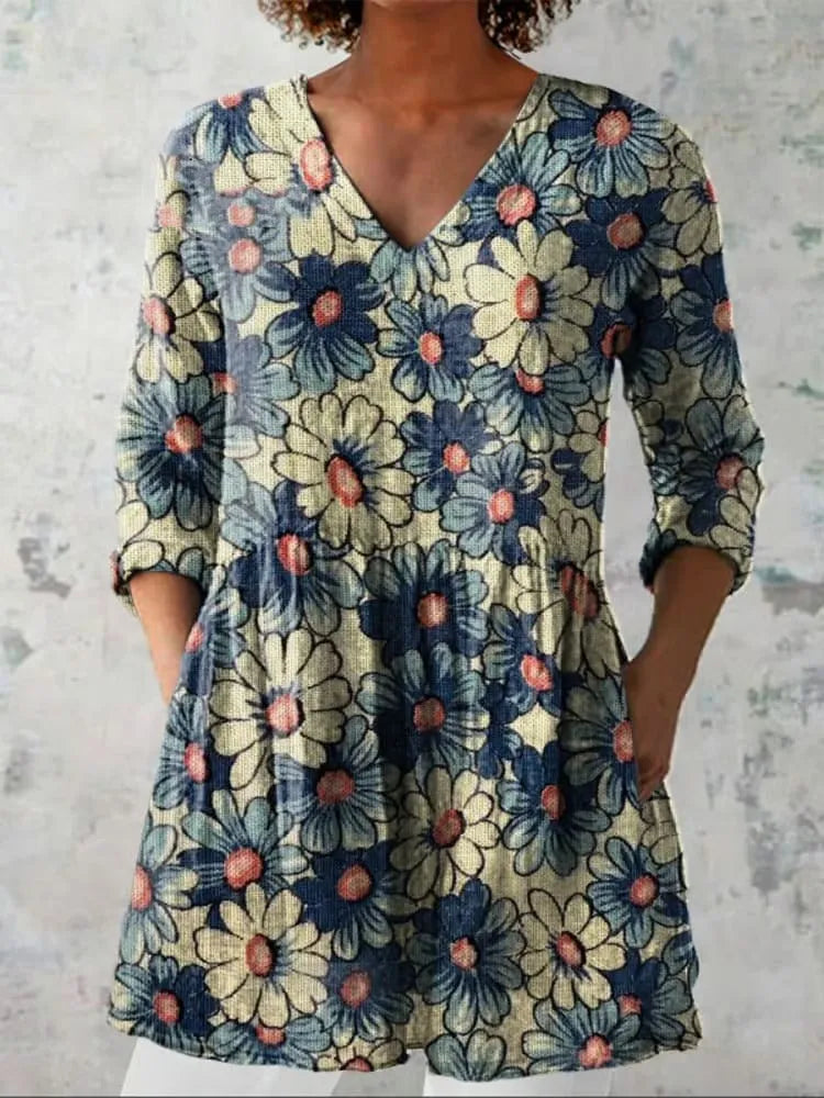 Women's slim-fit retro printed long-sleeved polyester top on a hanger, showing detail of digital print.