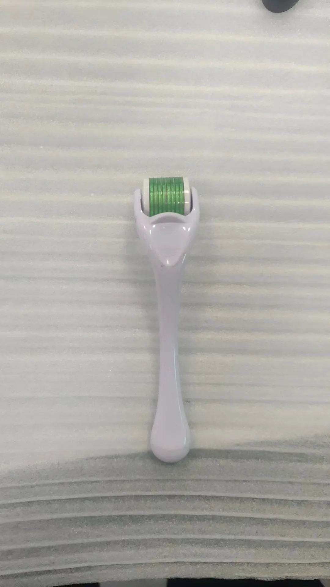 540 micro needle derma roller showing handle and wheel in different colour combinations with size specifications