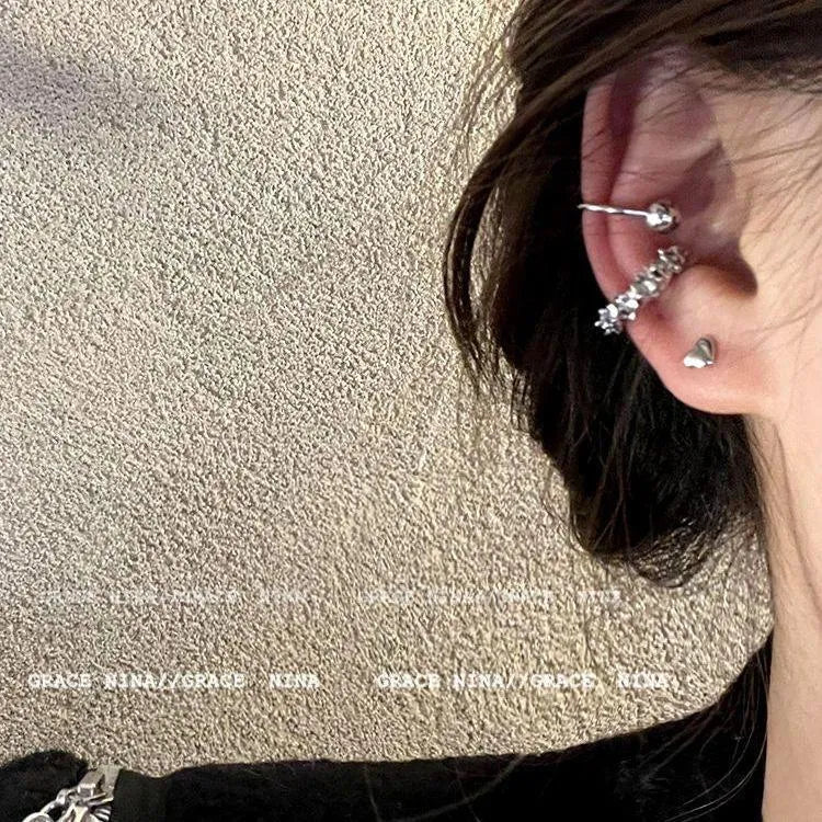 A pair of alloy clip-on earrings with an irregular geometric shape and frosty B4710 colour.