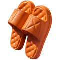 A pair of thick-soled EVA bathroom slippers in a selected colour, showing the non-slip sole pattern.