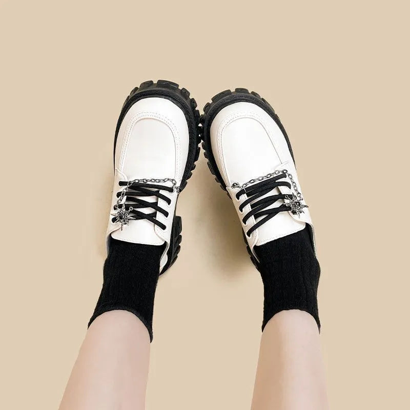 Women's Duke Asterism colour loafers with a round toe and metallic cross strap fastening.