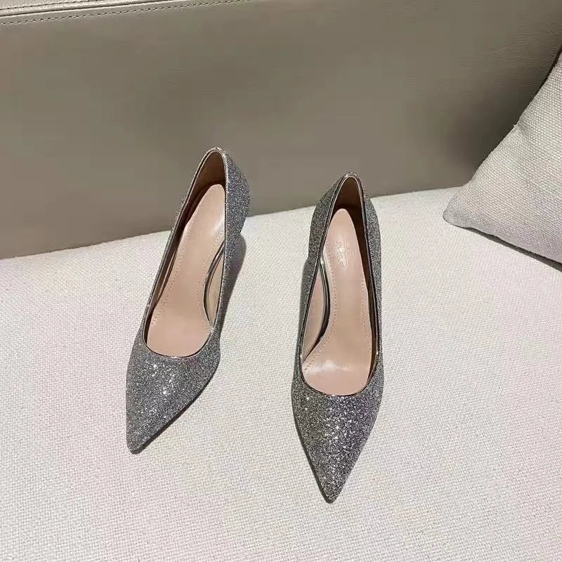 Women's silver and black bridal wedding shoes with crystal details and multiple heel heights