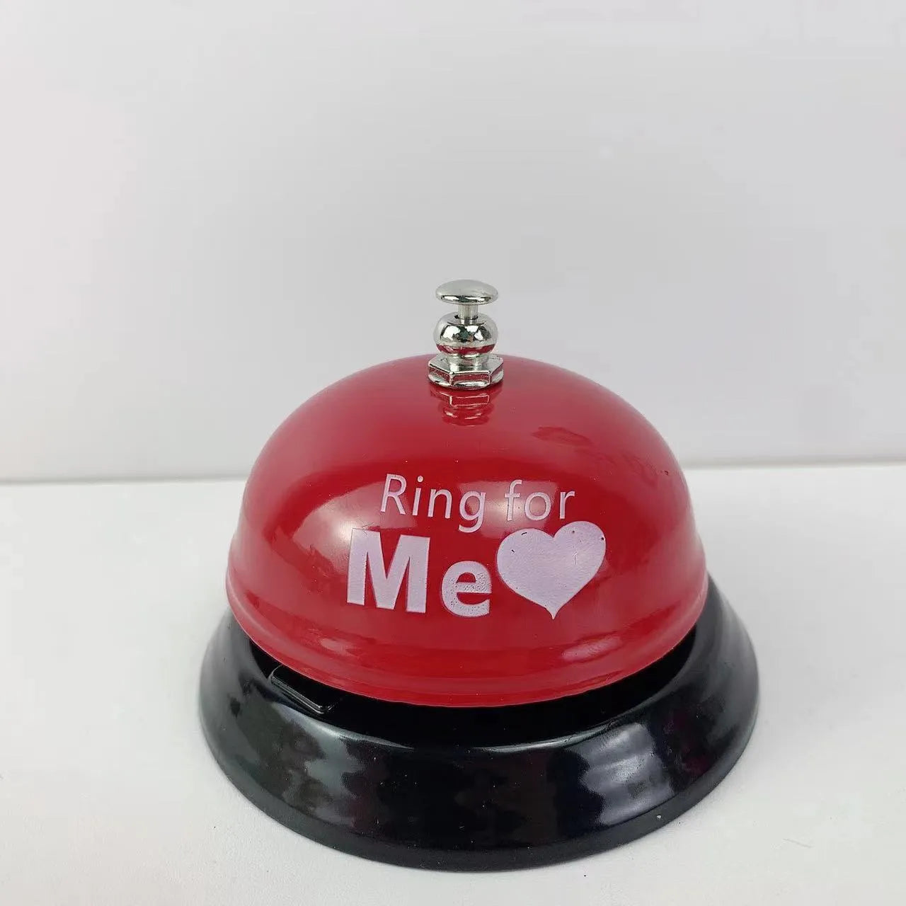 Handheld iron game bell in one of ten colours like red, blue, or green tea, for classroom or restaurant use.
