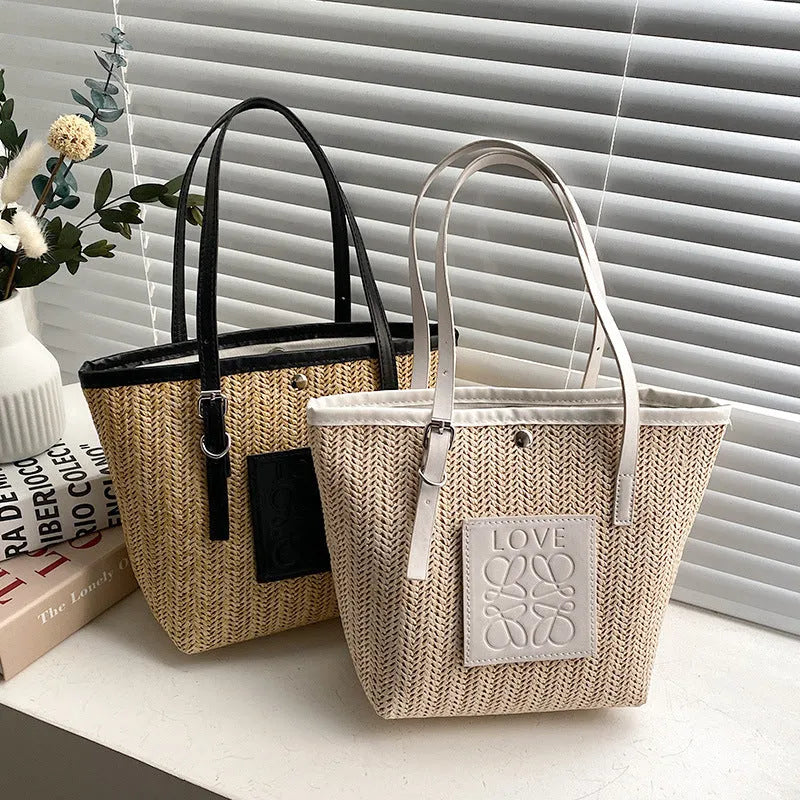 Straw woven women's shoulder bag in black showing European retro style with three-dimensional pocket
