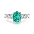 S925 silver emerald ring for women with inlaid high carbon diamonds in a geometric design on a white background.