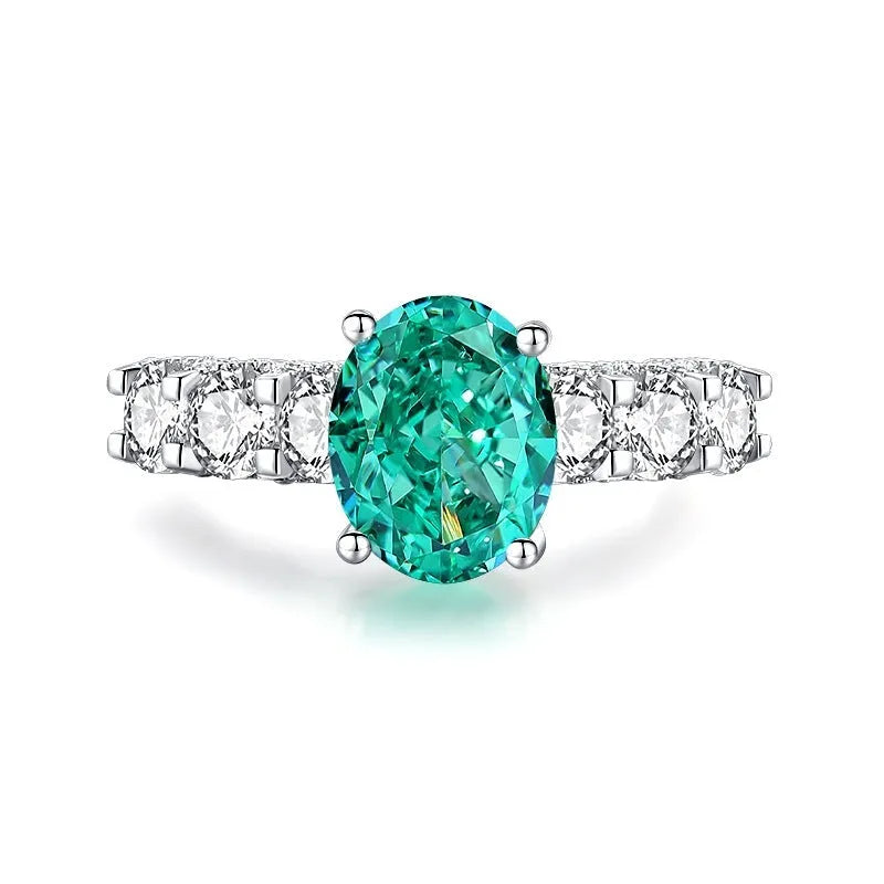 S925 silver emerald ring for women with inlaid high carbon diamonds in a geometric design on a white background.