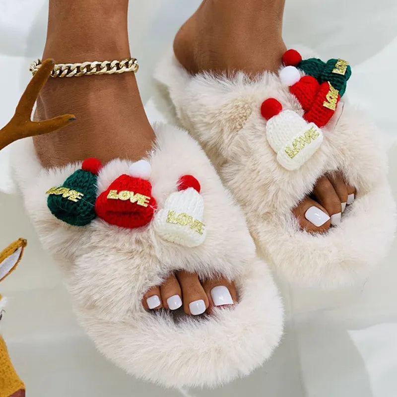 Women's black Christmas hat design faux plush slippers with a hairy texture and rubber sole.