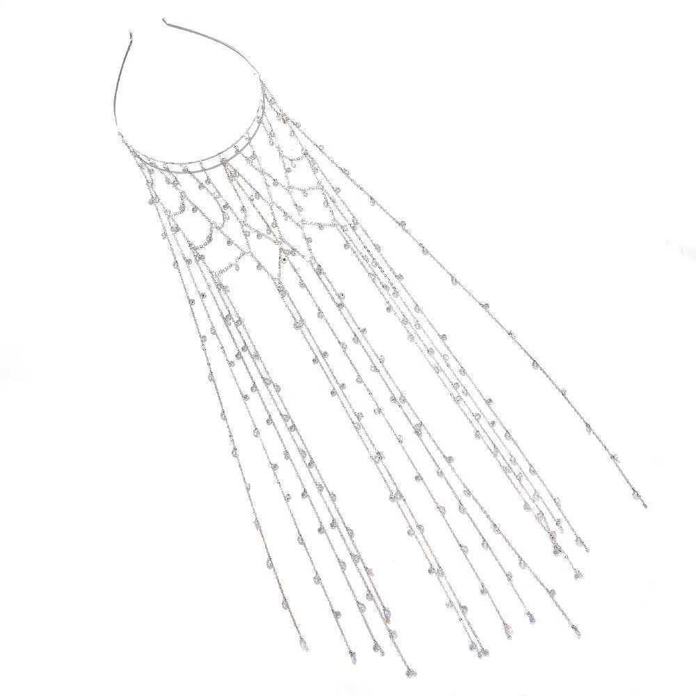 Gold rhinestone and mesh tassel headband on white background