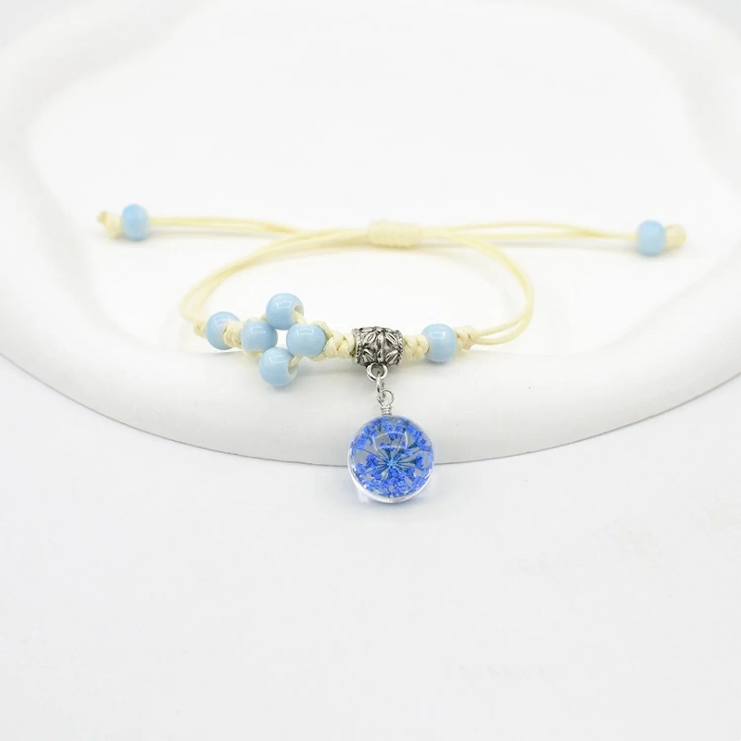 Glass dried flower bracelet with large 1.4 cm beads containing real preserved flowers in hand-woven lace design
