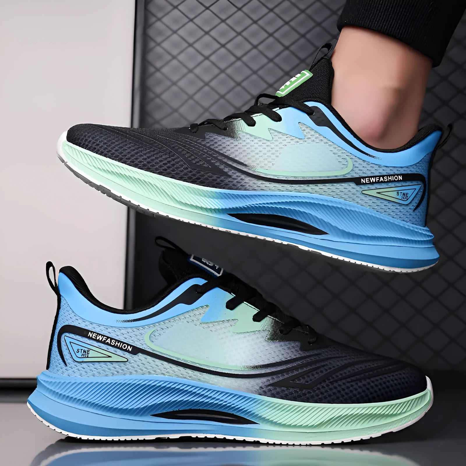 Men's solid colour casual shoes with mesh upper and rubber sole in black, blue, gray, and green options.