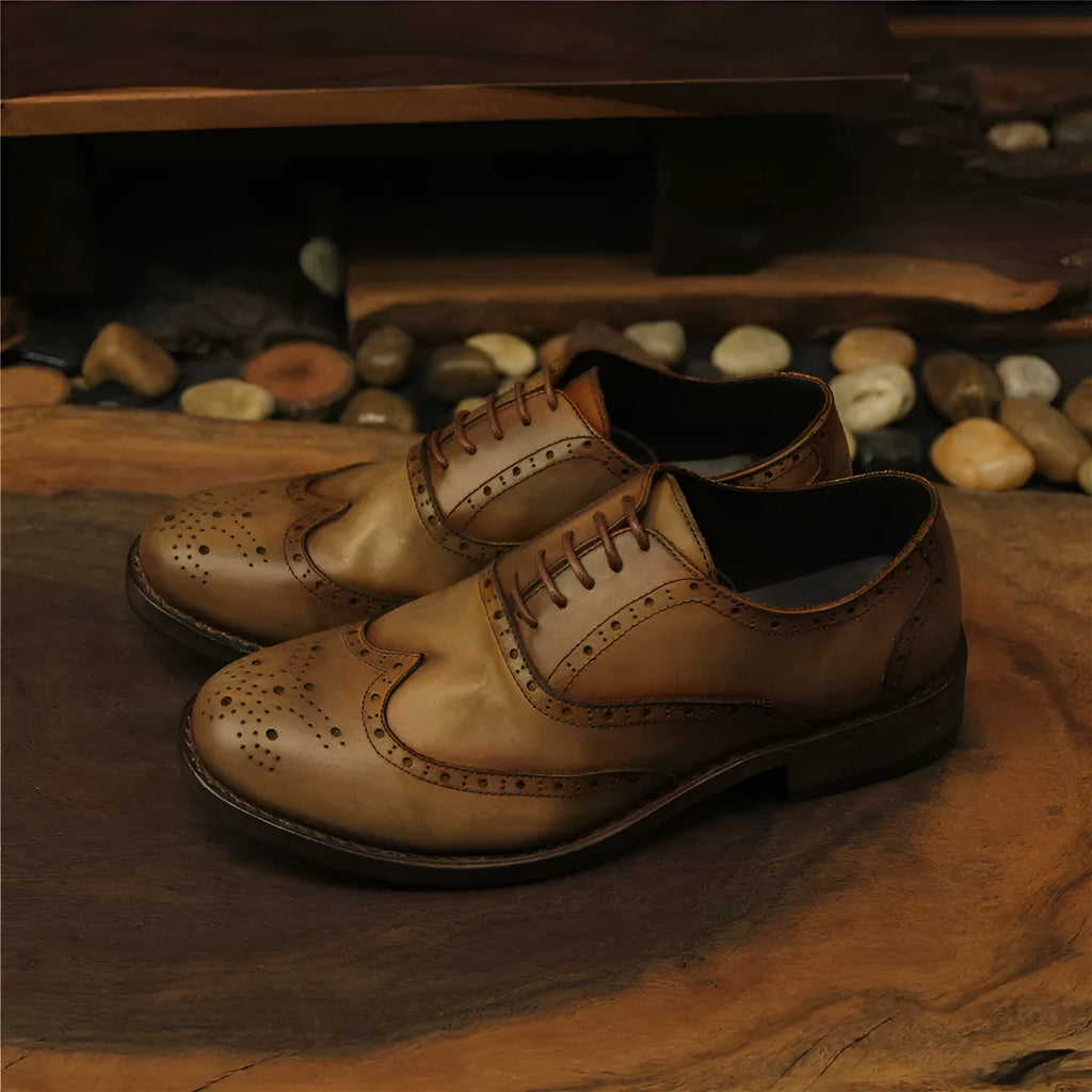Men's light brown vintage distressed leather casual shoes with engraved detailing and round toe.