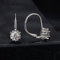 Sterling silver flower bud ear clip earrings with white gold plating and moissanite stone