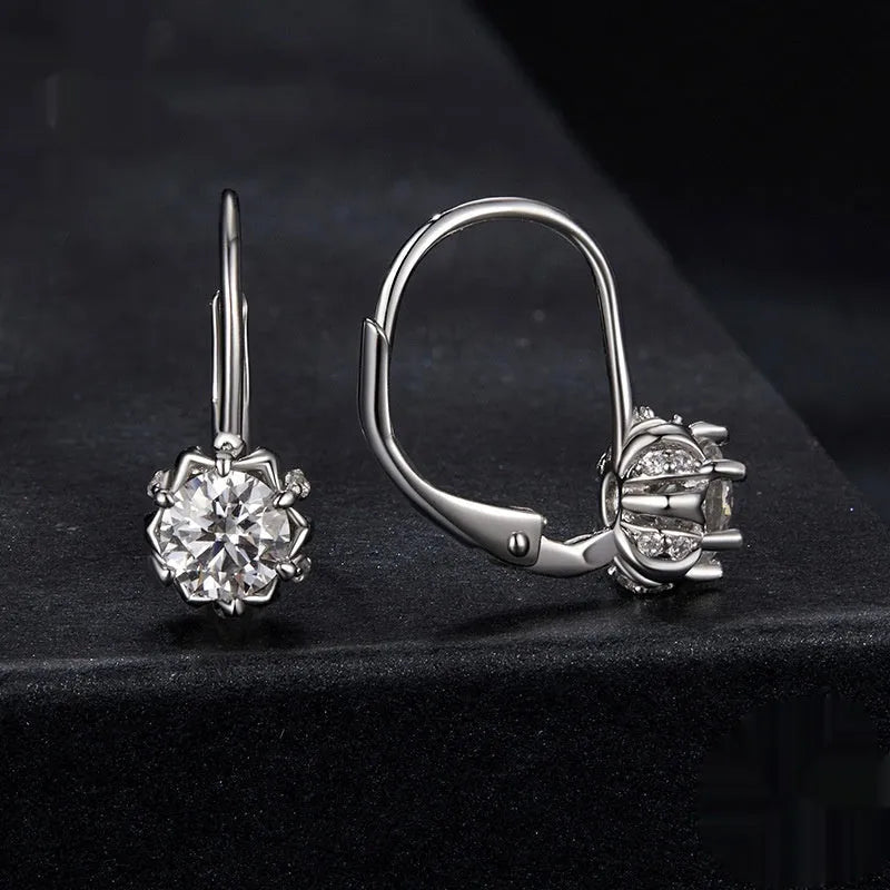 Sterling silver flower bud ear clip earrings with white gold plating and moissanite stone