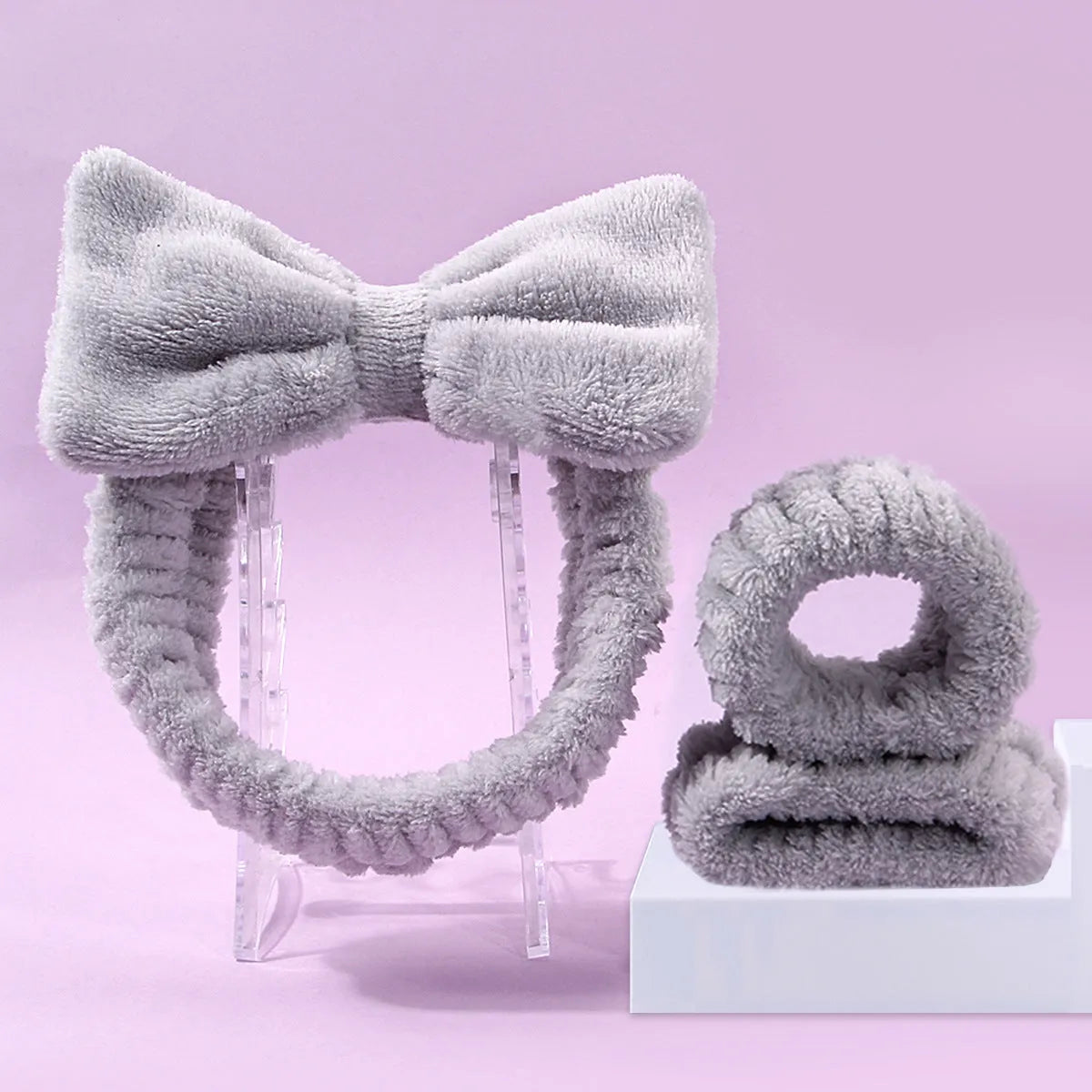 Facial brush set with coral fleece hair band, absorbent headband, and waterproof shower brush in purple colour