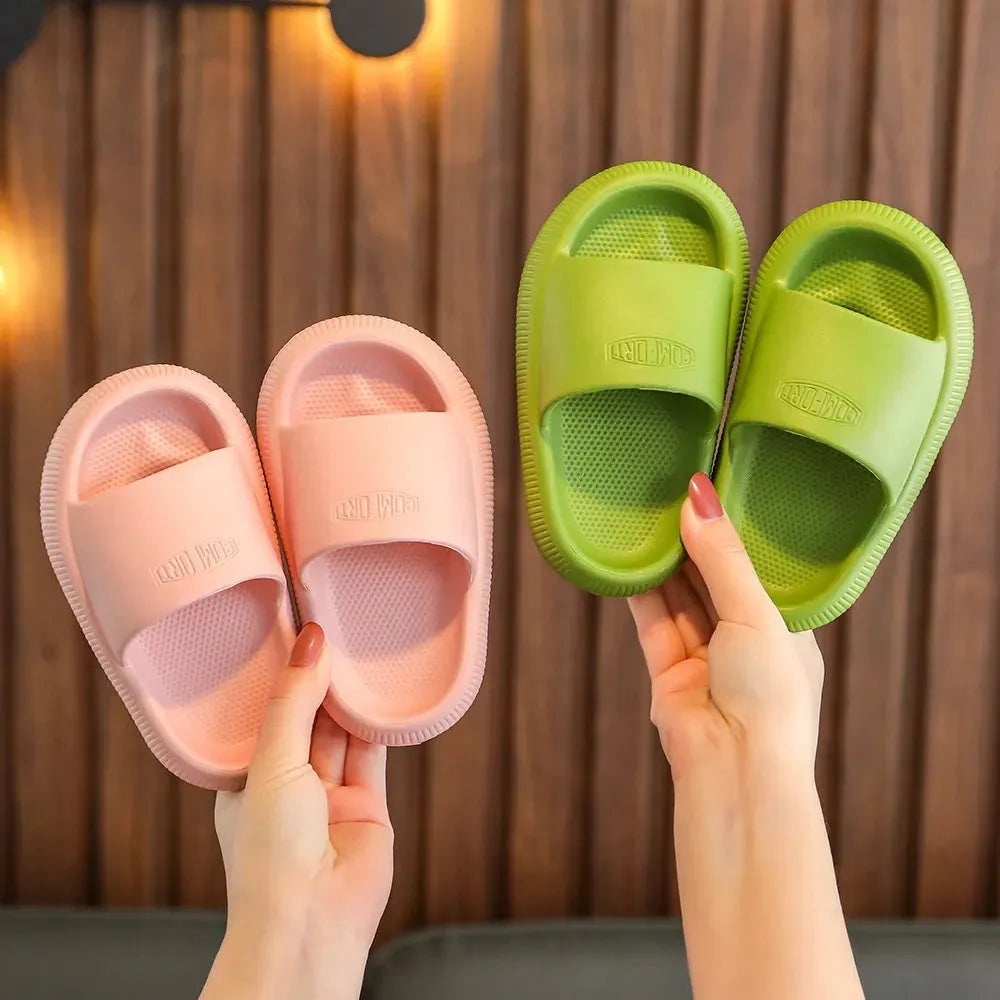 Children's mixed colour EVA slippers with non-slip soles showing size options from 15.5cm to 21.5cm