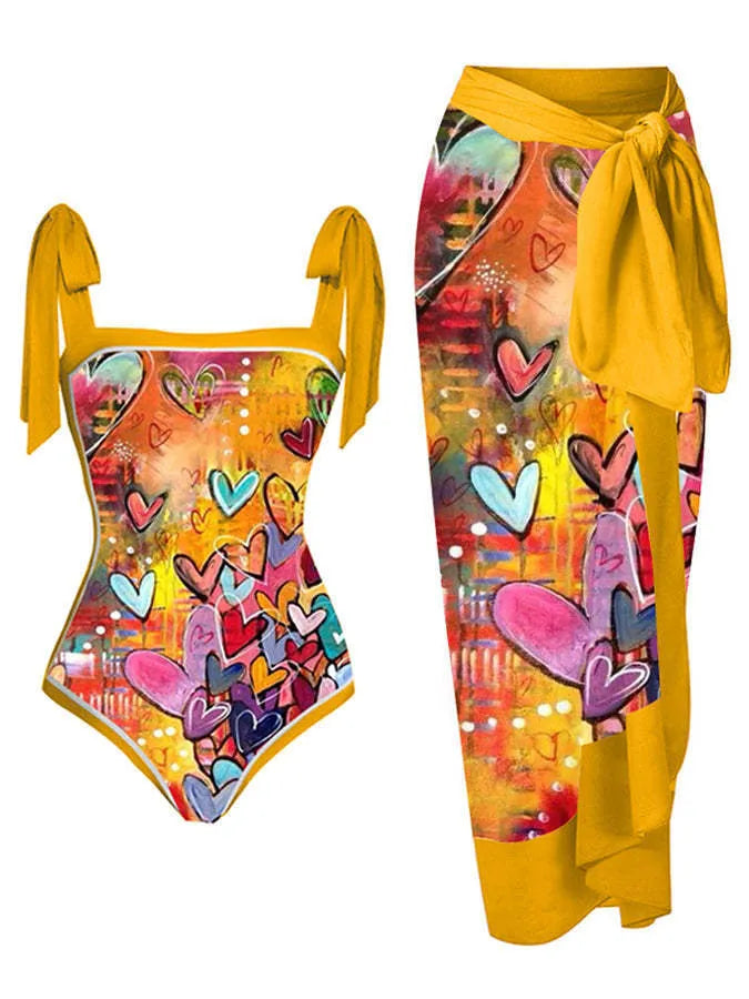 Women's printed chiffon two-piece swimsuit set with a separate hip skirt.