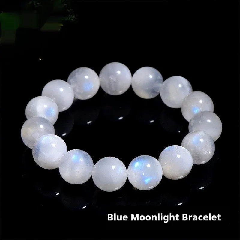 Natural blue moonlight round moonstone bead bracelet on wrist showing polished surface