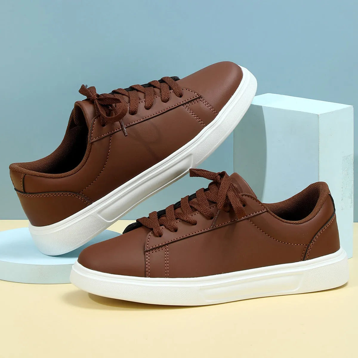 Platform skateboard sneakers in beige brown with cross strap and rubber sole