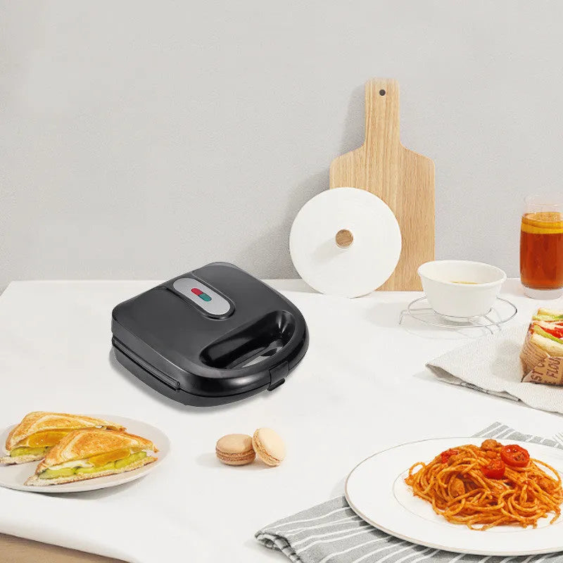 Black electric sandwich pan with double-sided heating and brushed stainless steel cover