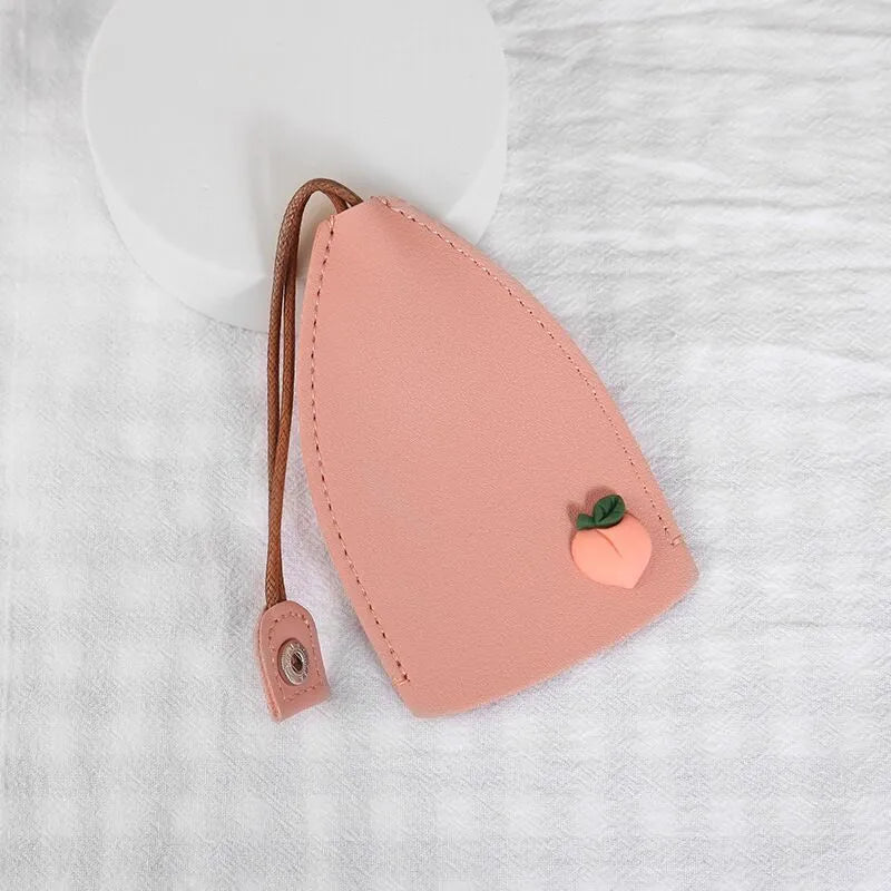 Cartoon design pull-out car key case made from soft PU leather, showing approximate size.