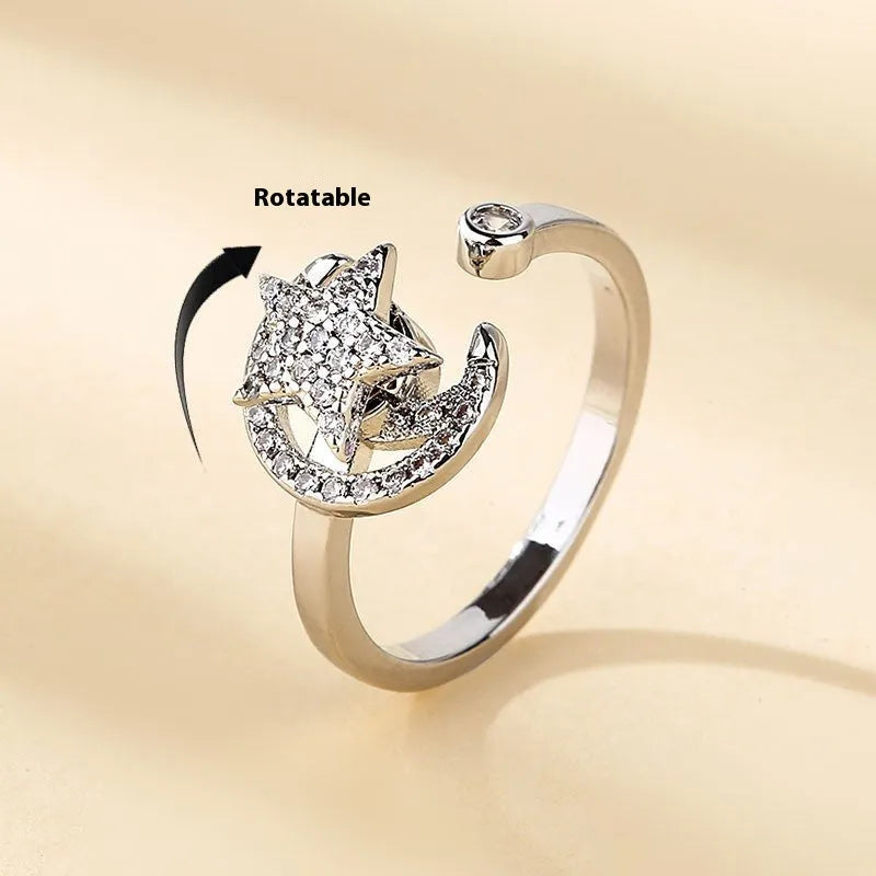 Micro-inlaid free rotating zircon star moon anti-anxiety ring in gold on white background
