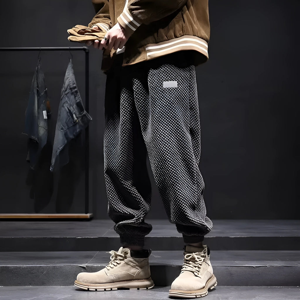Men's grey ankle strap sweatpants with straight leg cut on mannequin