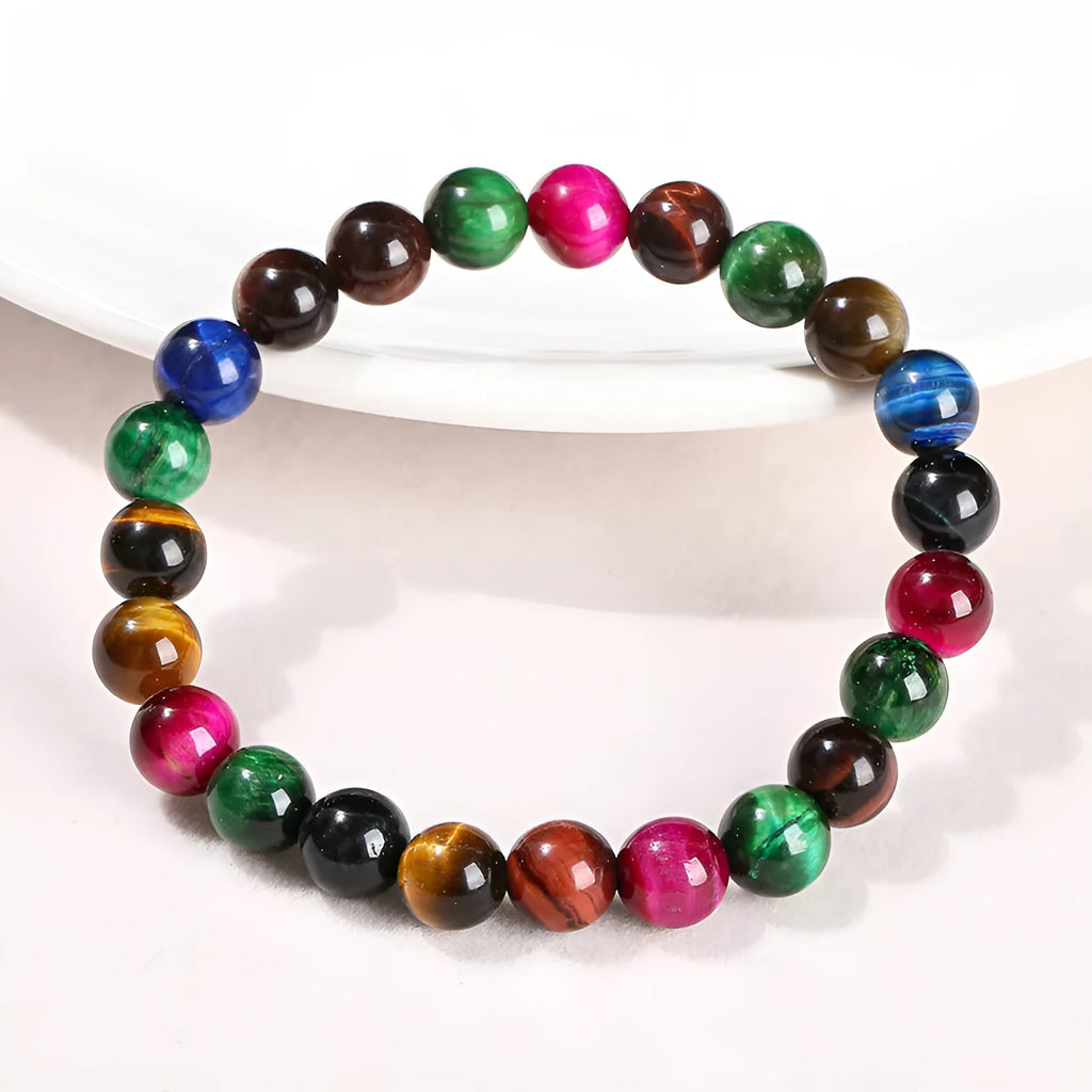 A colourful natural Tiger Eye beaded bracelet showing round beads on a string.