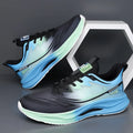 Men's solid colour casual shoes with mesh upper and rubber sole in black, blue, gray, and green options.