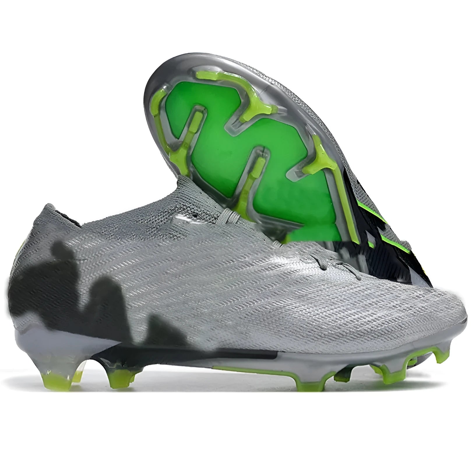 Men's low-top knitted football shoes with white/blue colourway, showing FG studs on rubber outsole and lace-up front.