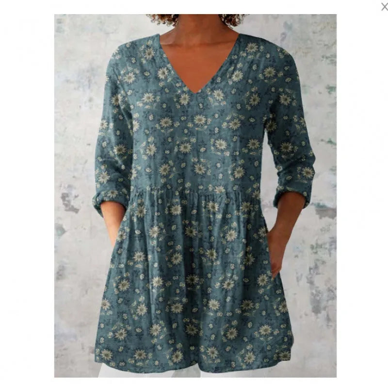 Women's printed loose wave dress with wide waist and three-quarter sleeves in a floral pattern.