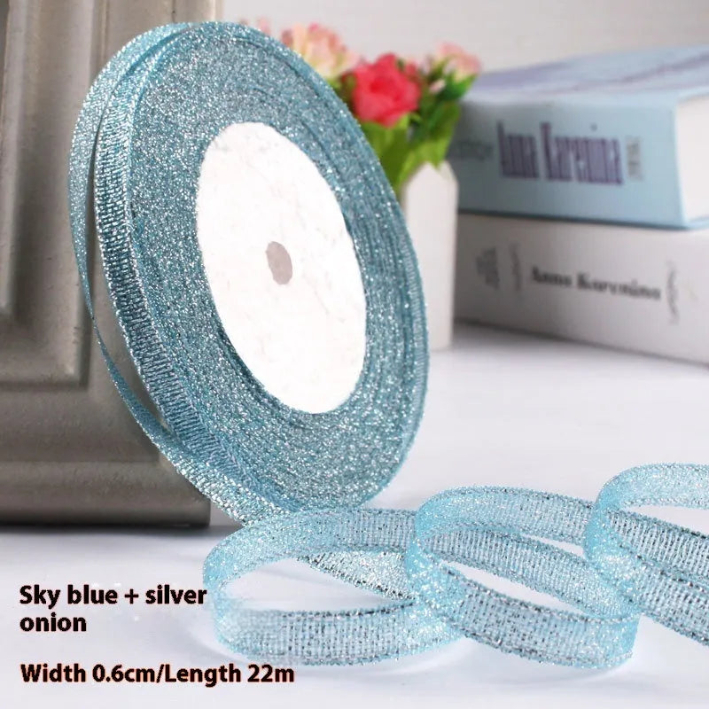 Roll of narrow 0.6cm wide polyester gift wrapping ribbon in assorted colours, showing 22 metre length.
