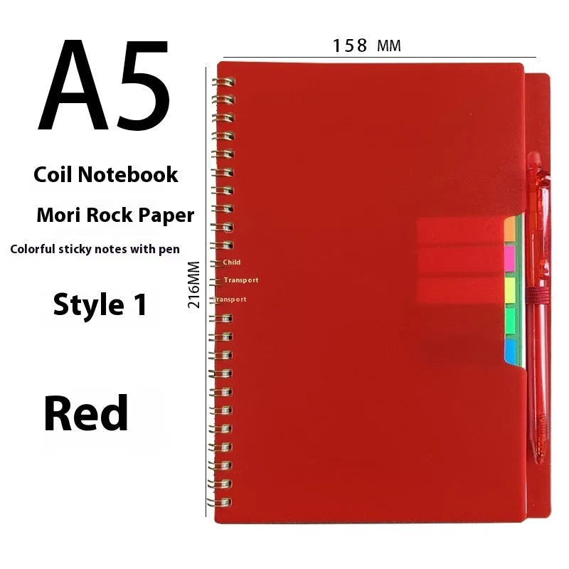 Erasable coil-bound notebook with customisable coloured cover on thick, reusable rock paper, shown with a pen.