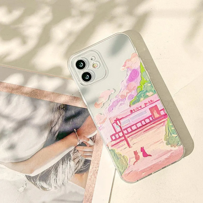 Soft silicone mobile phone case for iPhone with a colourful cartoon design of two cats on the back.