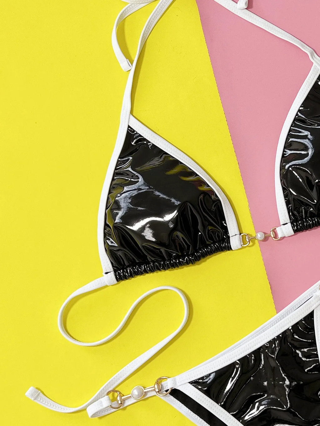Black women's split bikini swimsuit with briefs style on a mannequin.
