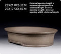 Handmade antique oval bonsai flower pot in purple sand for succulent plants.