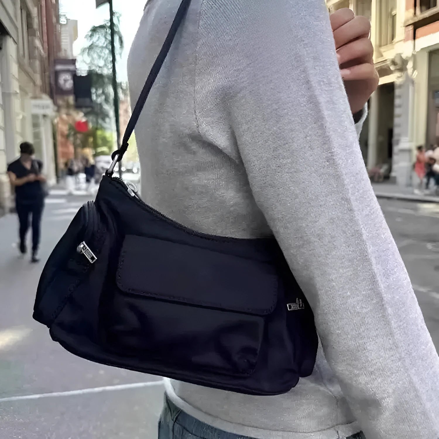Simple black lightweight nylon shoulder bag with two front pockets