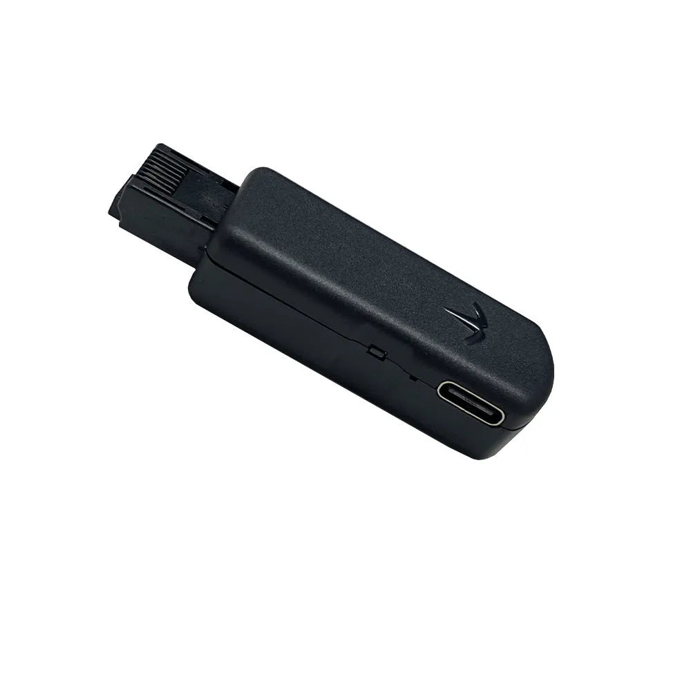 Black JB Tool USB host adapter for PlayStation with Ethernet port, shown with data cable and manual.