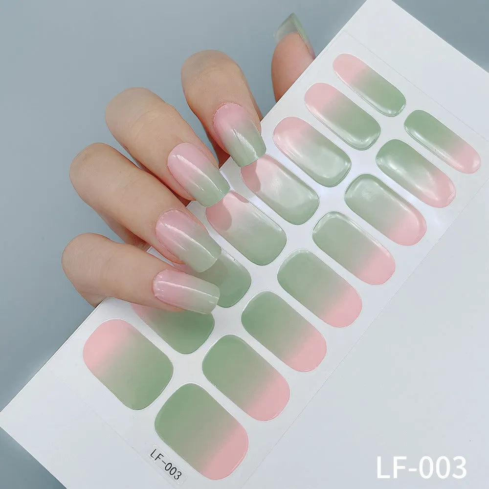 Set of 16 solid colour nail art stickers showing floral, geometric, and pattern designs for manicure application