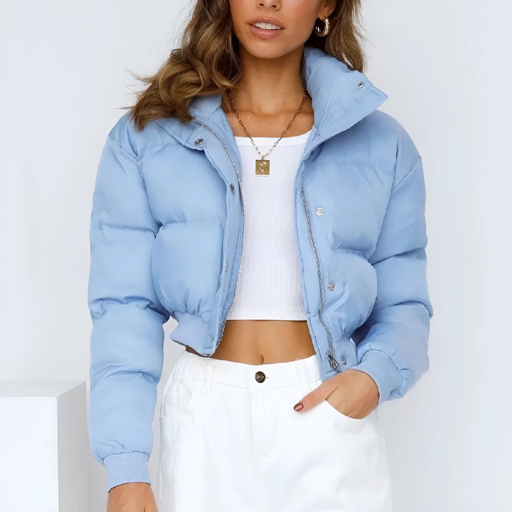Women's loose blue polyester jacket with long sleeves shown front view