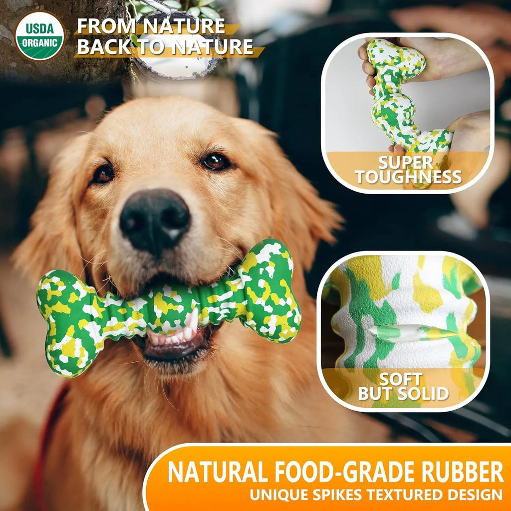 Green and white camouflage pattern natural rubber dog chew toy for large dogs on a wooden floor.