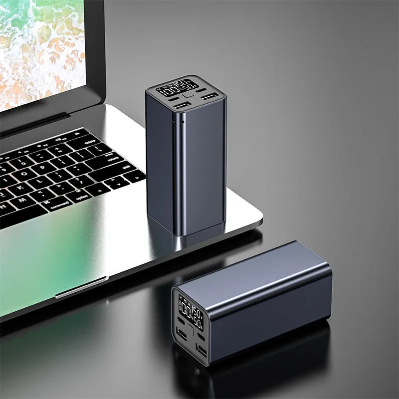 Black metal 65W laptop power bank with 20000mAh capacity showing USB ports