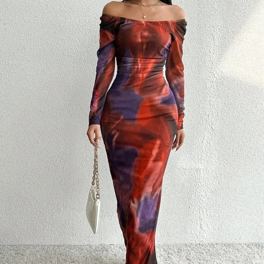 Womens long printed mesh fishtail dress with gradient colour pleating and split skirt detail