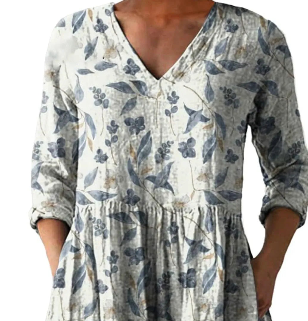 Women's printed loose wave dress with wide waist and three-quarter sleeves in a floral pattern.