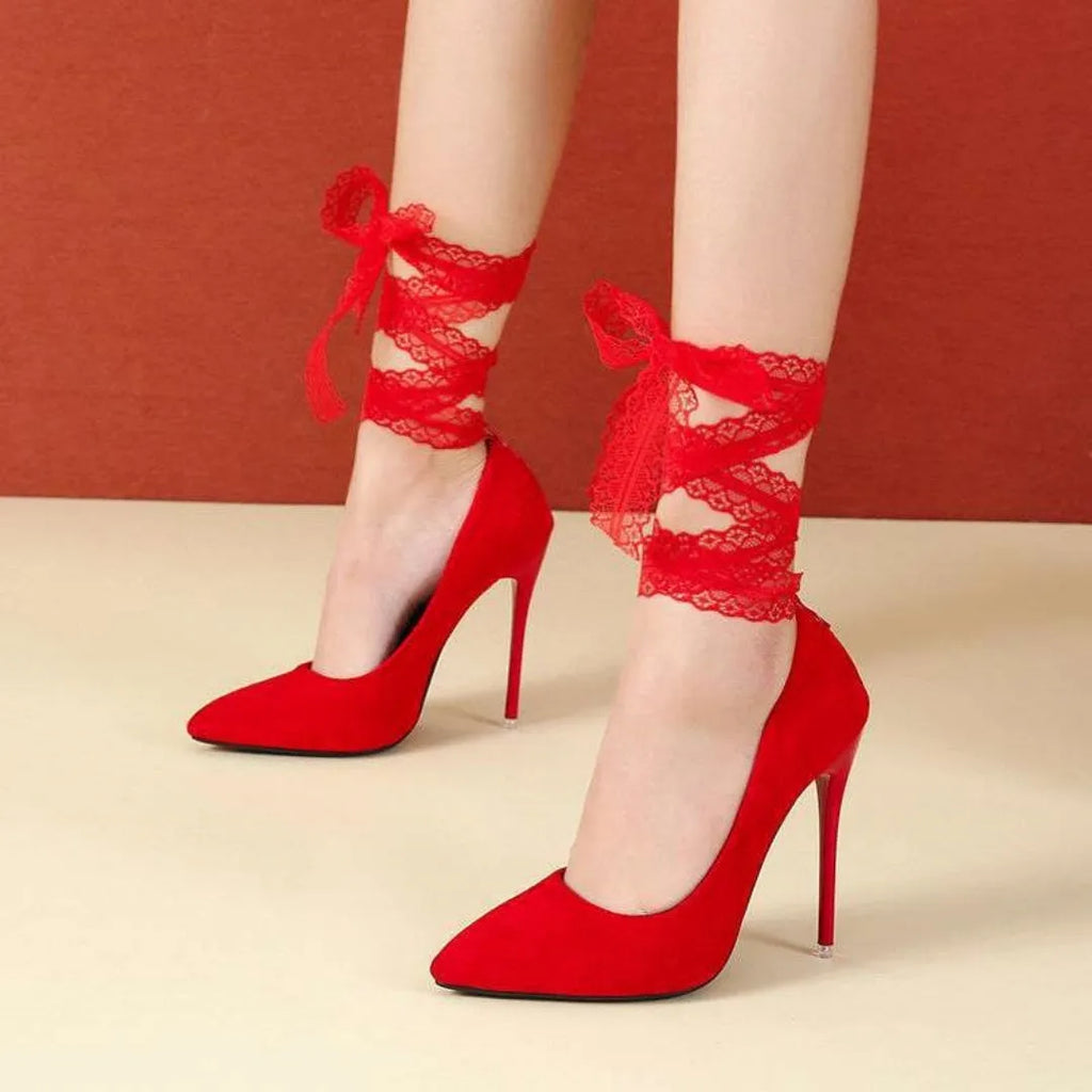 Black pointed toe high heel pump with a lace strap across the foot on a 12cm heel.