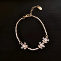 Gold-tone copper bracelet with geometric design and inlaid zircon stones for women