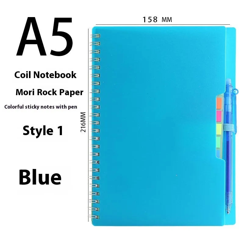 Erasable coil-bound notebook with customisable coloured cover on thick, reusable rock paper, shown with a pen.