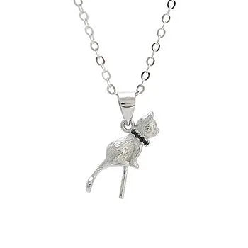 Close-up of a sterling silver cat silhouette pendant on a delicate silver chain.