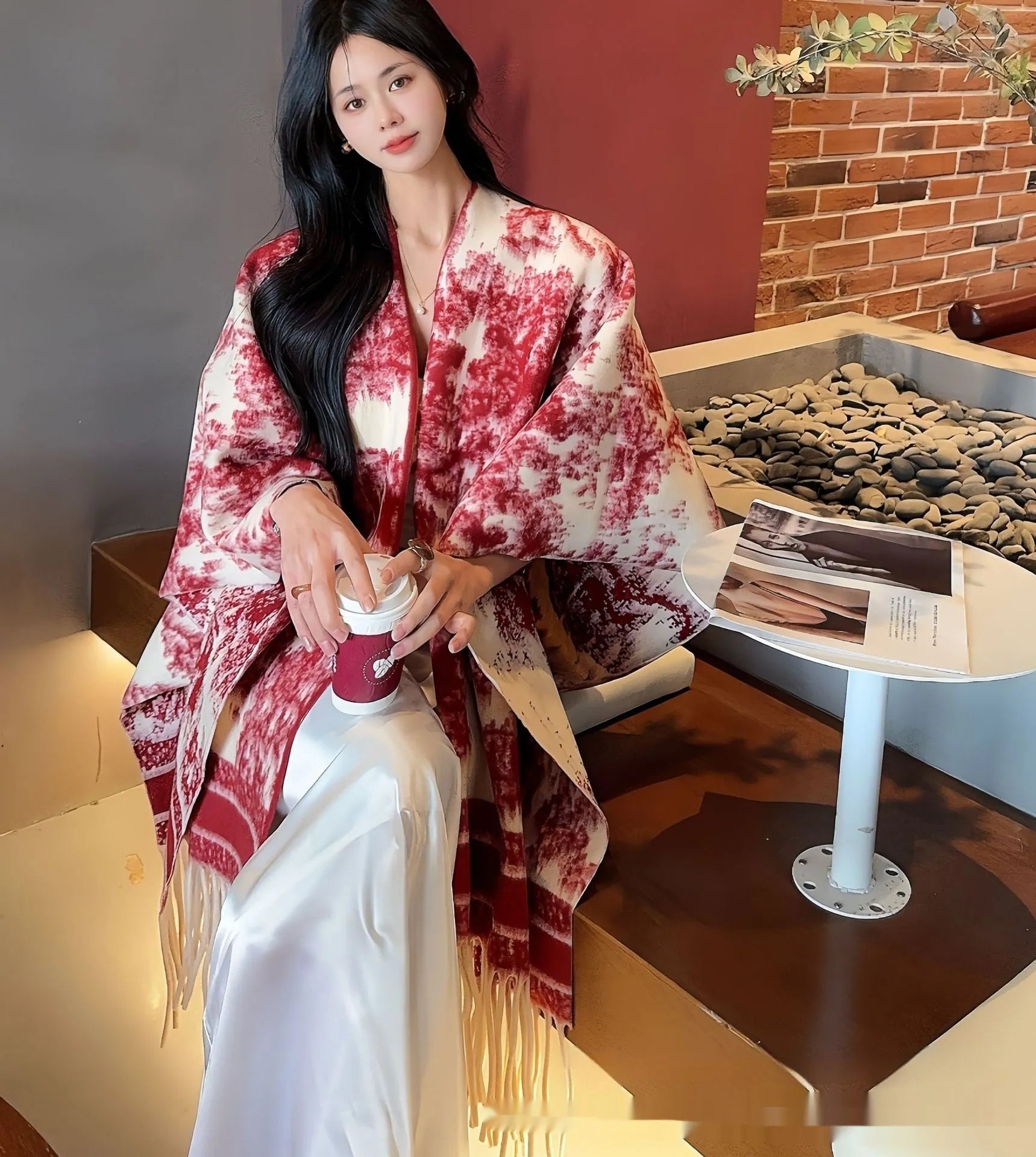 Women's polyester scarf cape with long fringed tassels, shown in a selection of available colours.