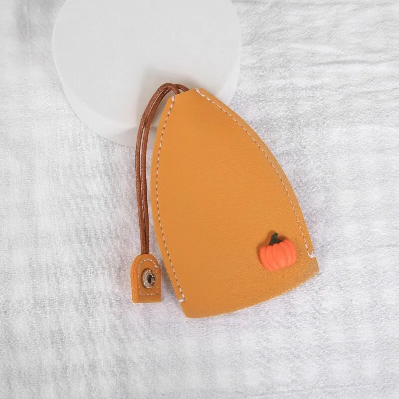 Cartoon design pull-out car key case made from soft PU leather, showing approximate size.